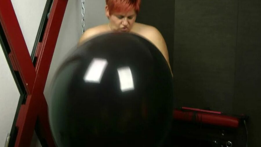 Naked with big black balloon