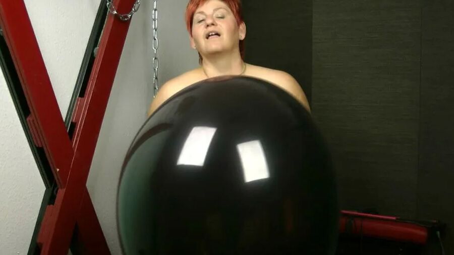Naked with big black balloon