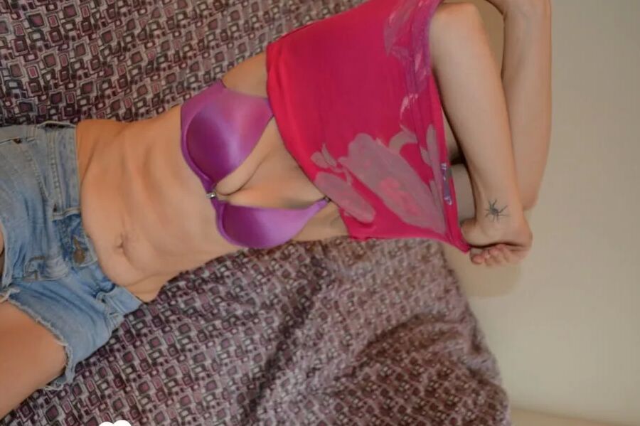 Tattooed chick passionately plays with her pussy
