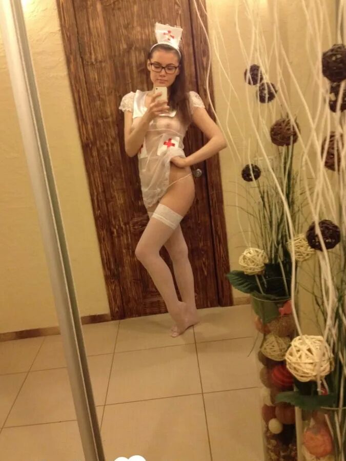 Smoking brunette pulls off the best nurse costume