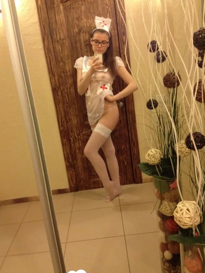 Smoking brunette pulls off the best nurse costume