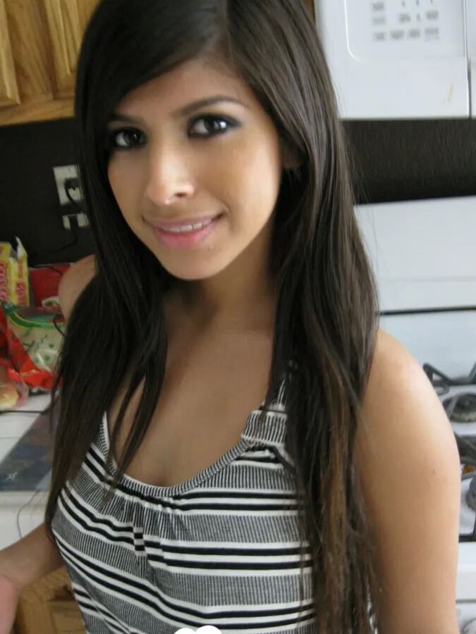 Busty cutie spreads her pussy lips wide