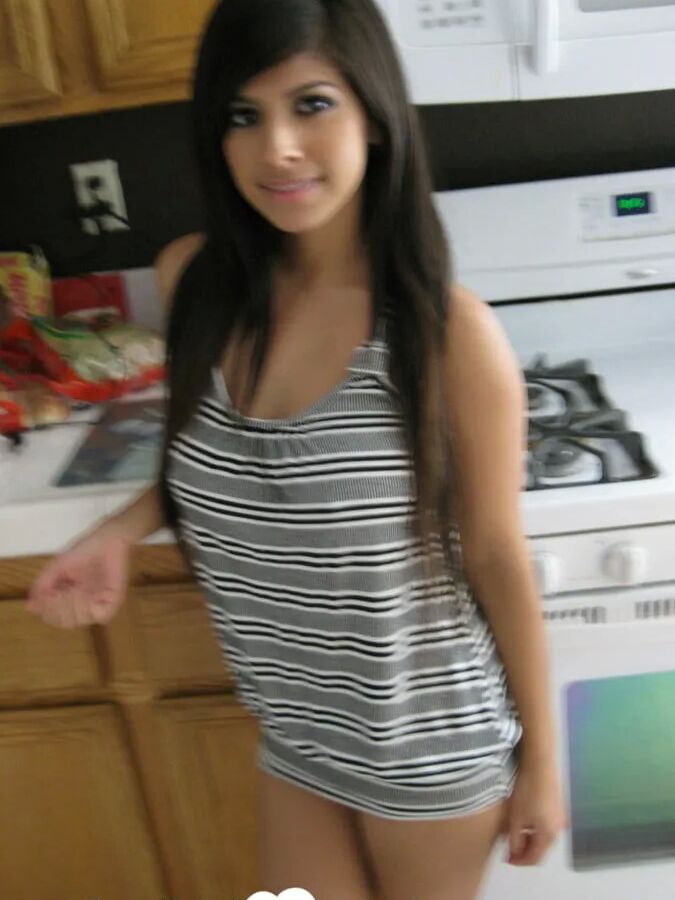 Busty cutie spreads her pussy lips wide