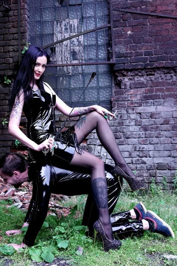 Dominatrix Nika on a walk with her slave.