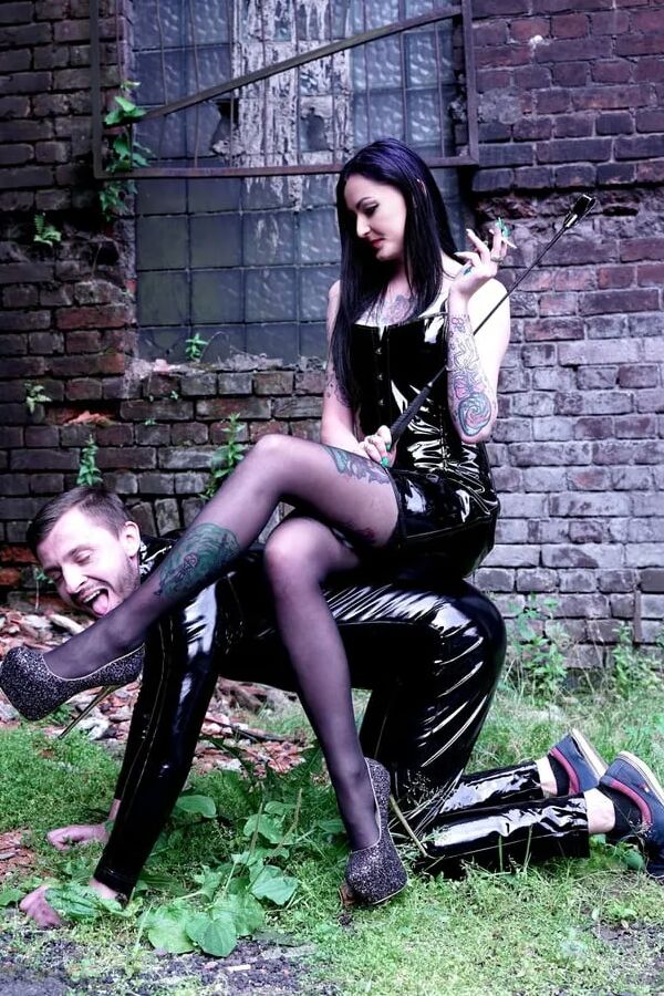 Dominatrix Nika on a walk with her slave.