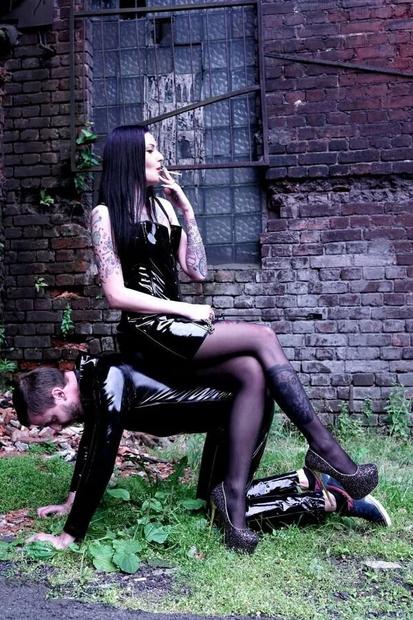 Dominatrix Nika on a walk with her slave.