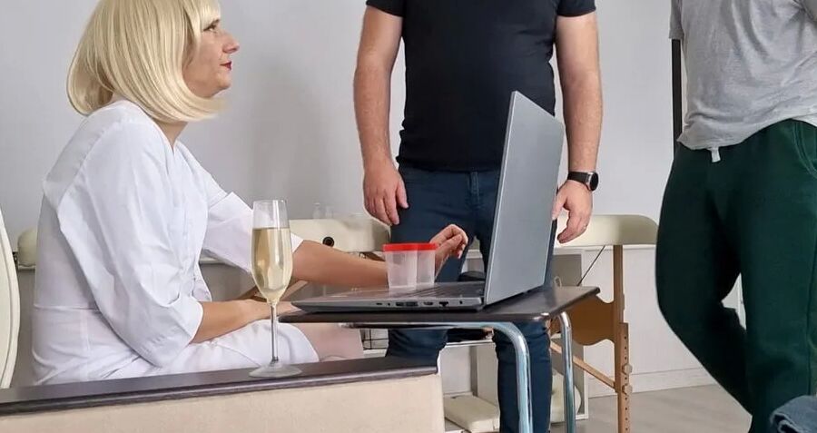 Sperm donation at the doctor's office. Nurse helps two men c