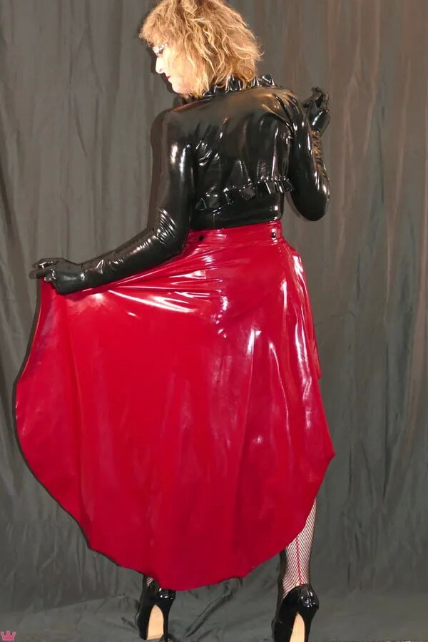 Long Red Latex Skirt with Fishnets and sexy Heel Pumps