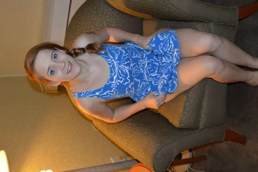 Lovely redhead sits on her pink dildo