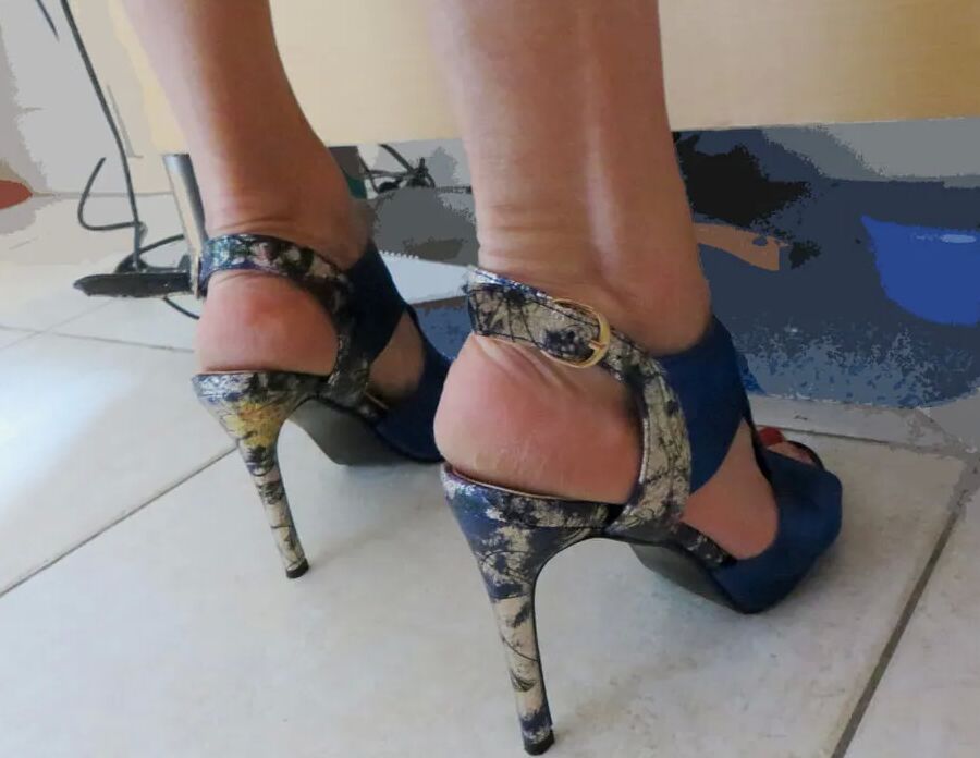 She dresses for the party - her blue slingbacks