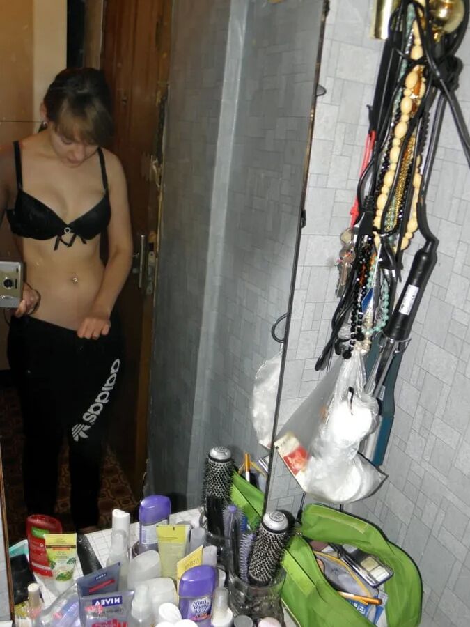 Petite teen slowly strips off her clothes