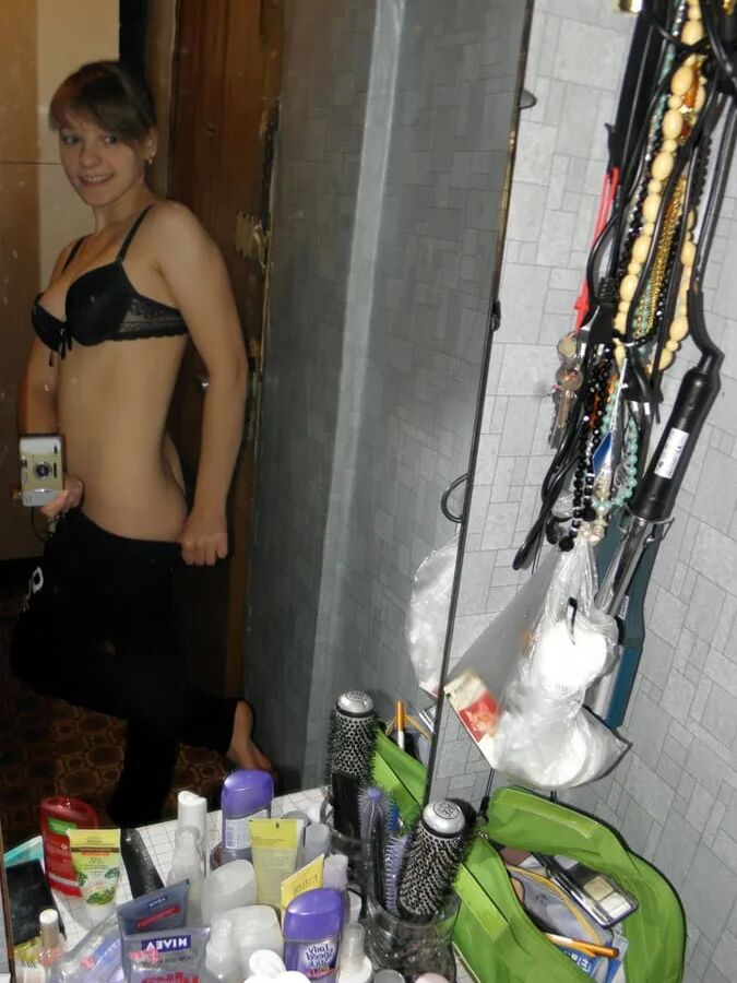 Petite teen slowly strips off her clothes