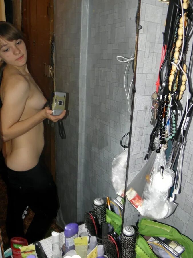 Petite teen slowly strips off her clothes