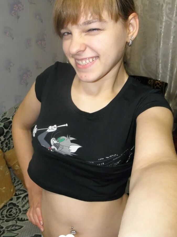 Petite teen slowly strips off her clothes
