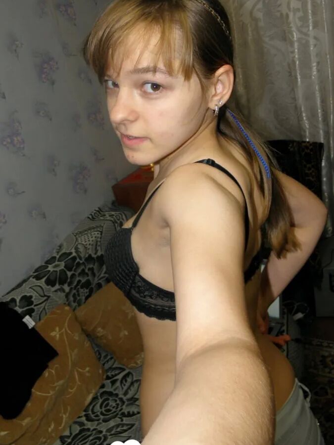Petite teen slowly strips off her clothes