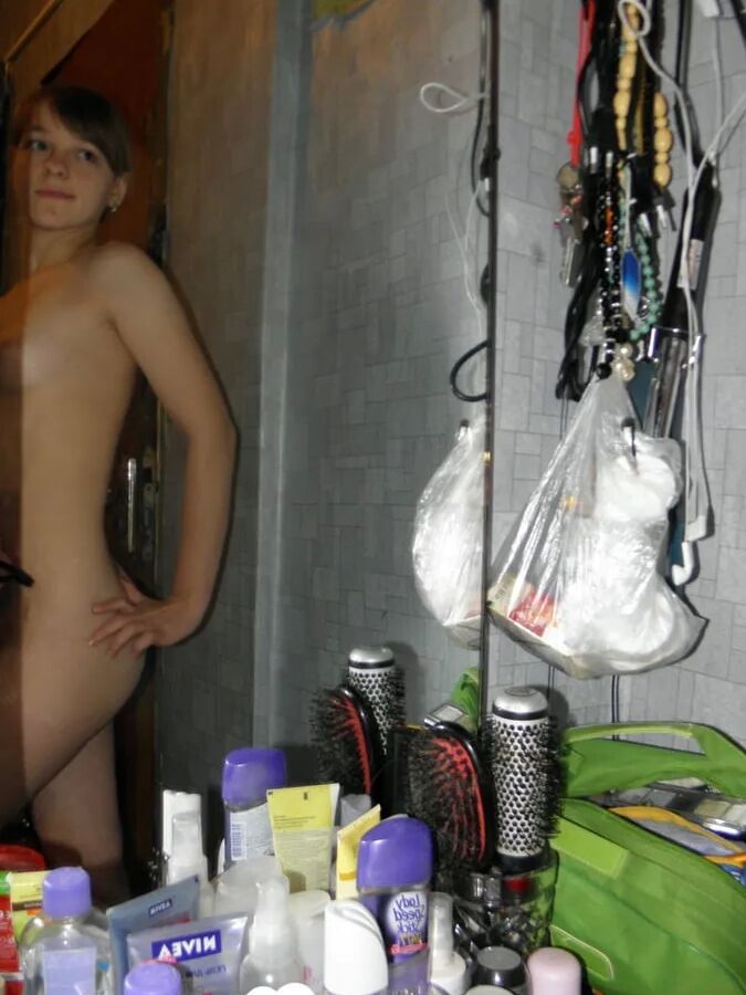 Petite teen slowly strips off her clothes