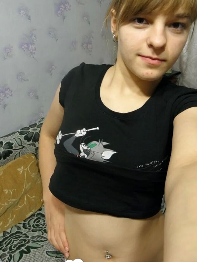 Petite teen slowly strips off her clothes