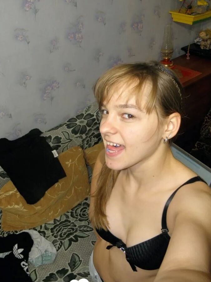 Petite teen slowly strips off her clothes