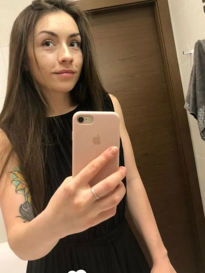 Gorgeous brunette with a tattoo loves to tease
