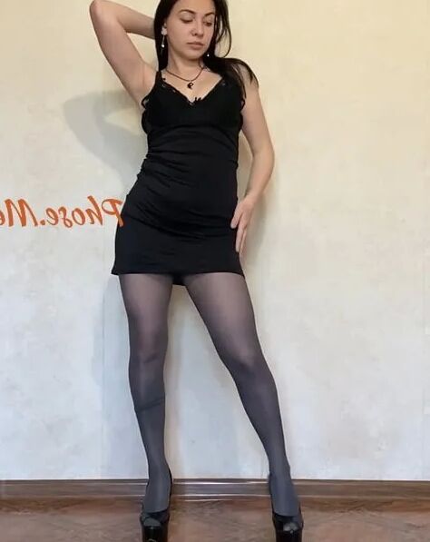 Amber In Black Dress and Grey Pantyhose and High Heels