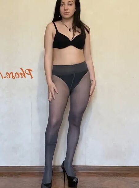 Amber In Black Dress and Grey Pantyhose and High Heels