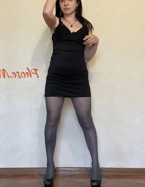 Amber In Black Dress and Grey Pantyhose and High Heels