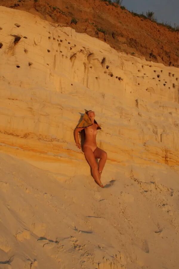 Posing Naked on White Sand in Sunset Time