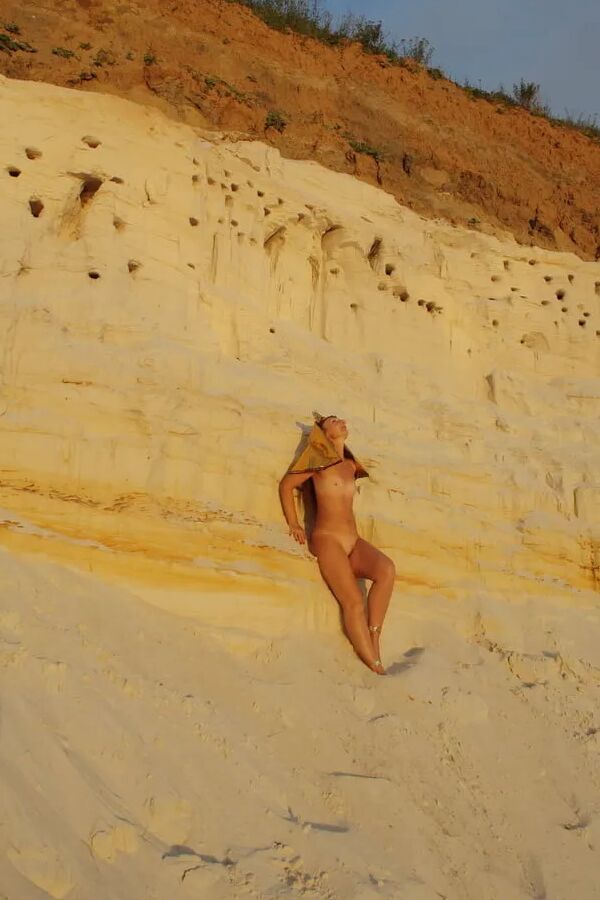 Posing Naked on White Sand in Sunset Time