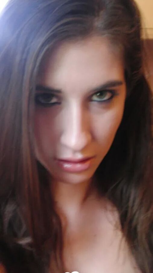 Brunette cutie gets some cum over herself