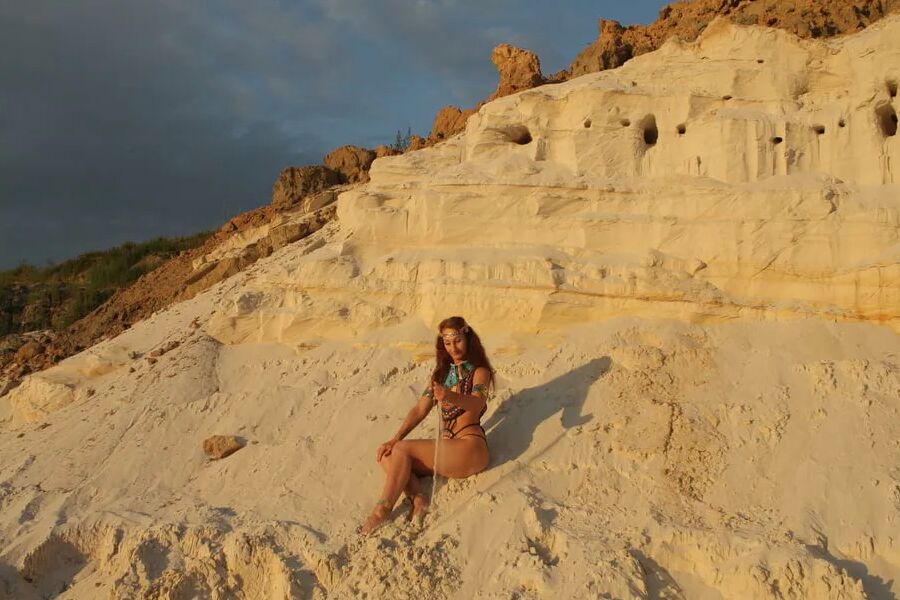 On sunset on pink sand