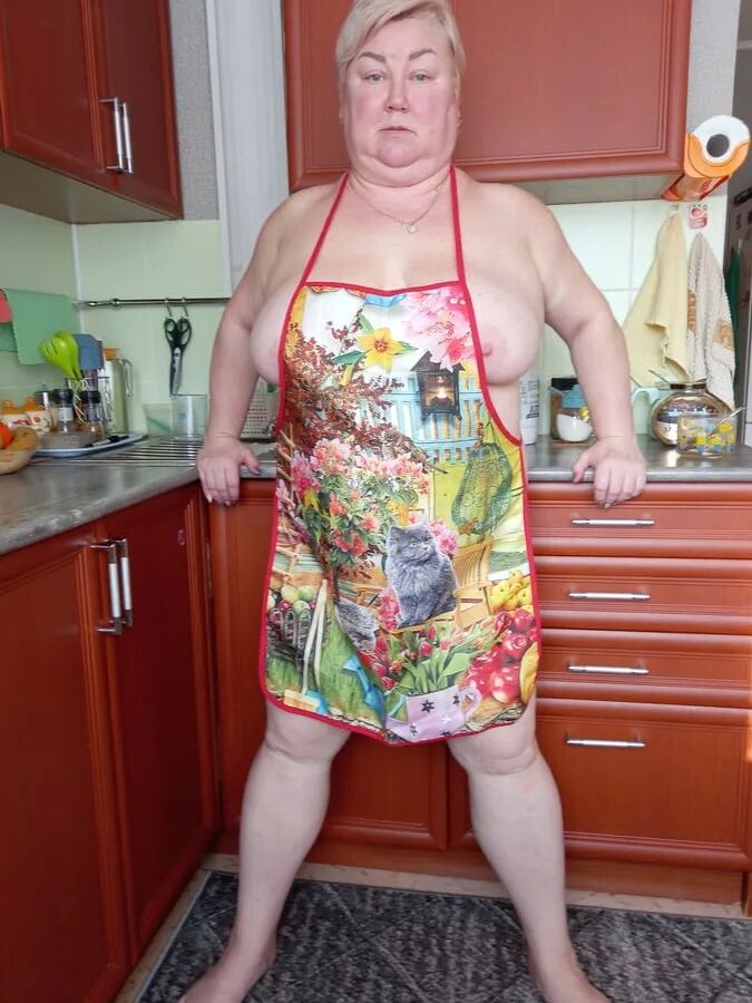 In the kitchen in an apron