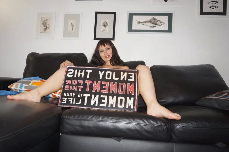 Brunette Milf On Leather Couch