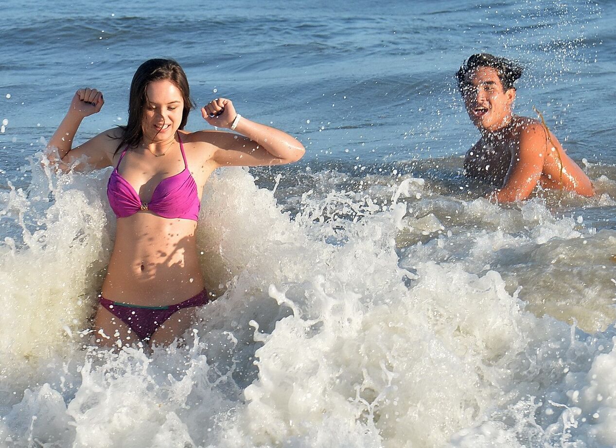 Hayley Orrantia shows off her hot body in a skimpy pink bikini at the beach in L