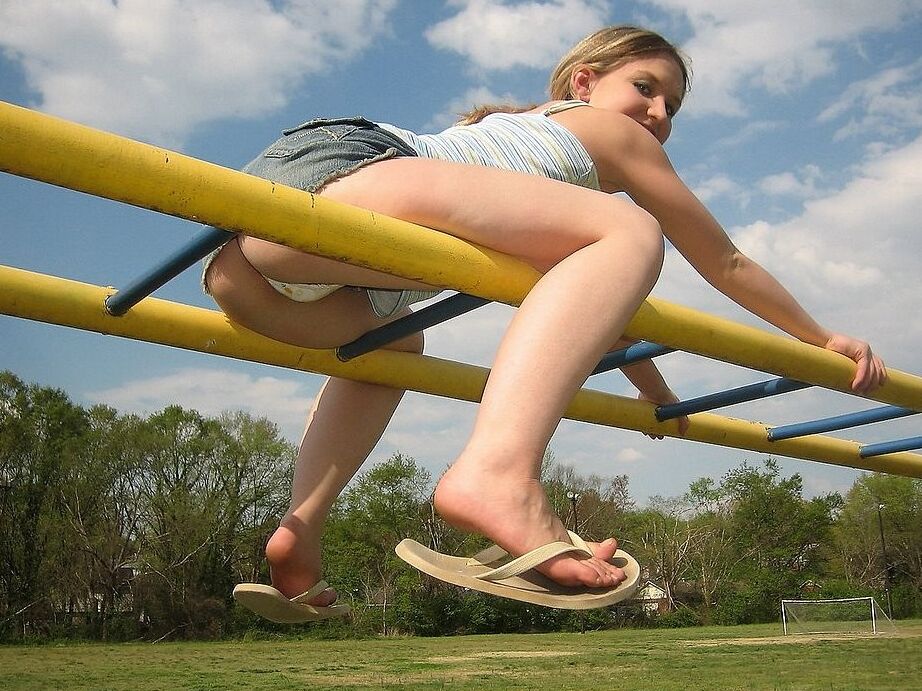 Petite teen flashing her little titties in playground