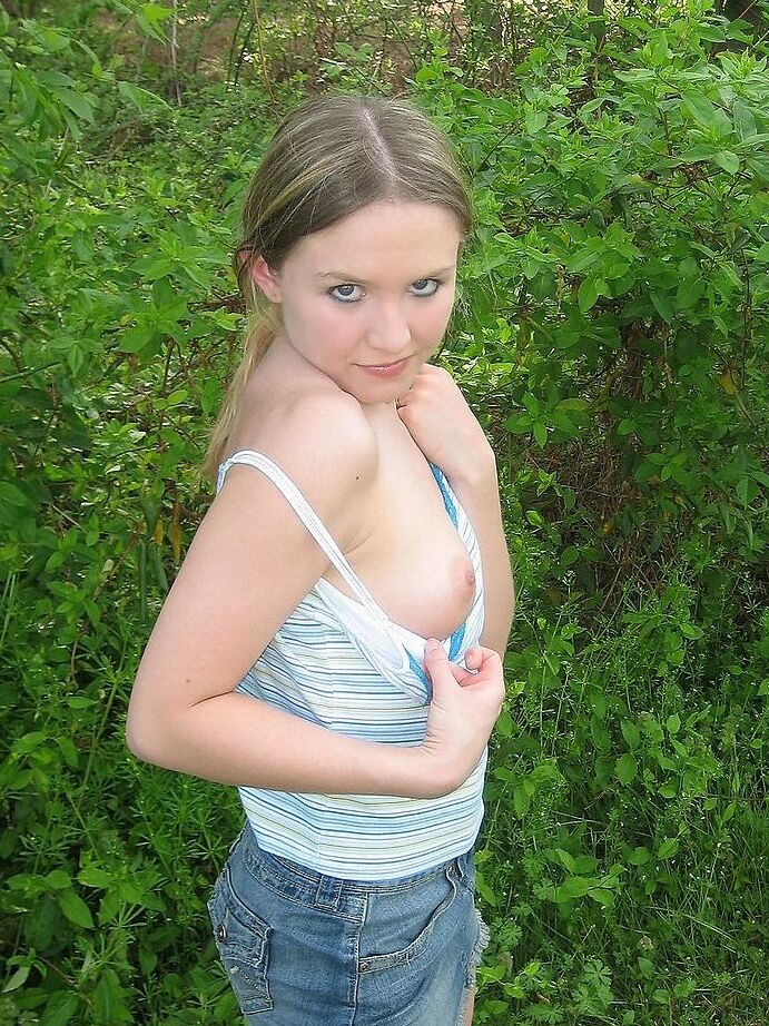 Petite teen flashing her little titties in playground