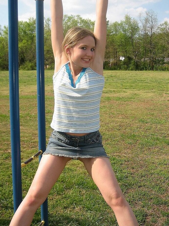 Petite teen flashing her little titties in playground