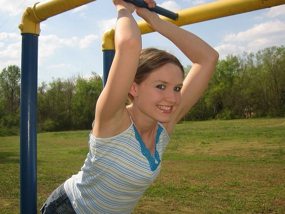 Petite teen flashing her little titties in playground