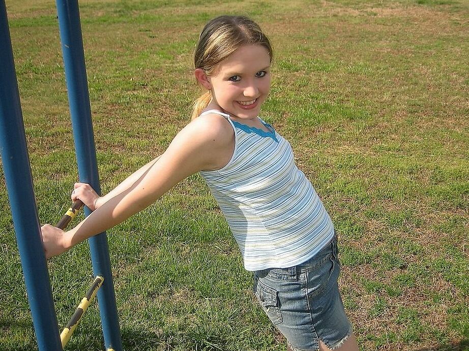 Petite teen flashing her little titties in playground