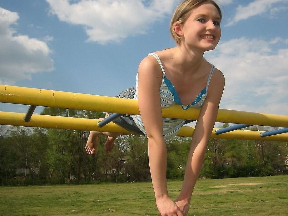 Petite teen flashing her little titties in playground