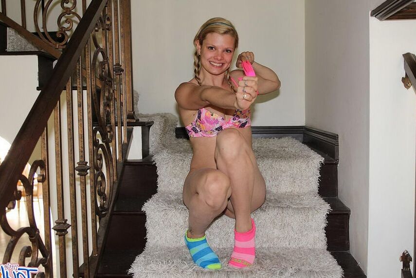 Blonde teen strips and masturbates on the steps