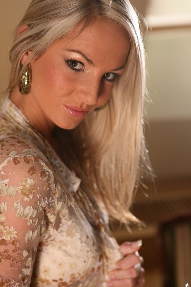 Busty blonde Czech beauty spreads on the floor after striptease