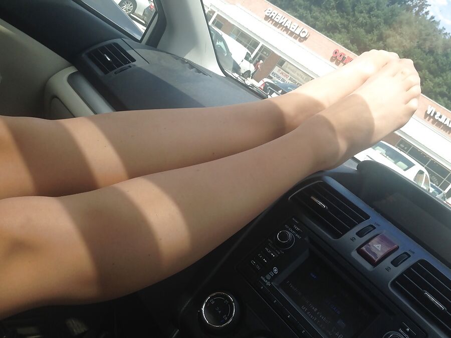 Pantyhose feet on dashboard