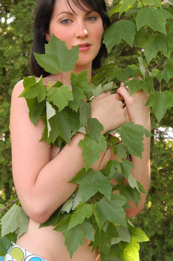 Pictures of a brunette teen getting naked outside