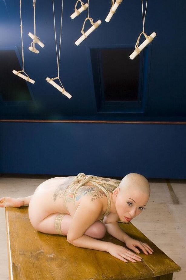 Bald chick gets covered with candle wax