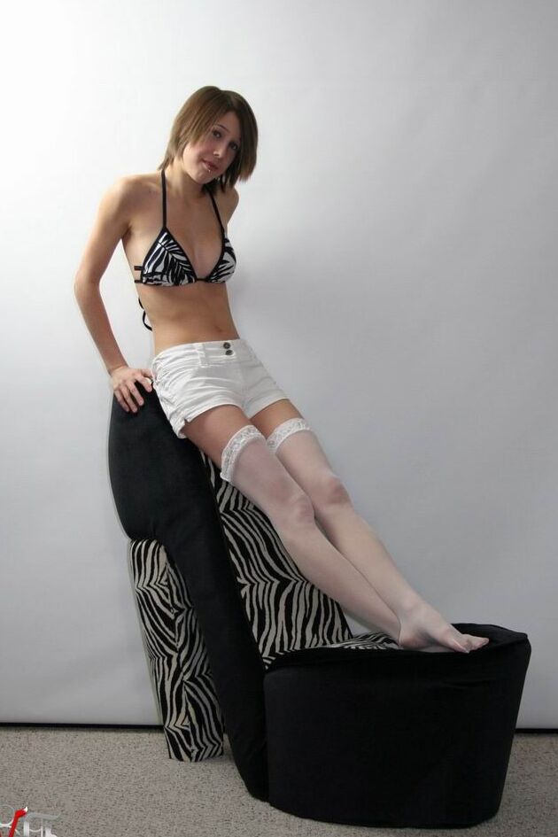 Shy brunette teen with beautiful legs in white stockings