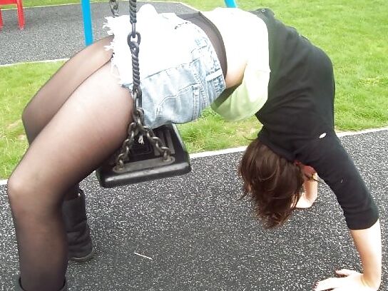 Babes in pantyhose-girl on a swing.