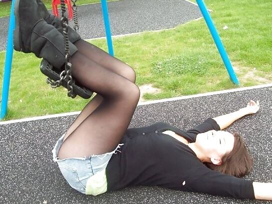 Babes in pantyhose-girl on a swing.