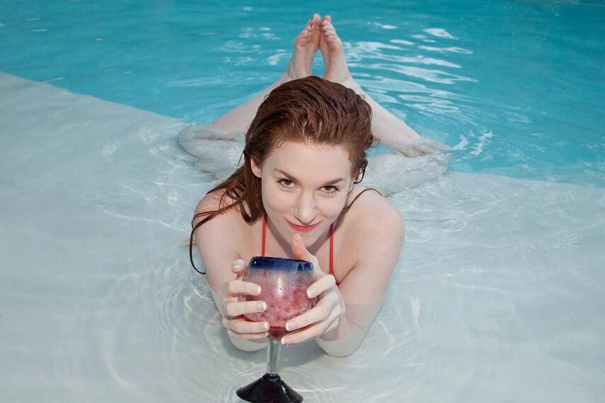 Redhead teen Holly Steele gets all wet for you in the pool