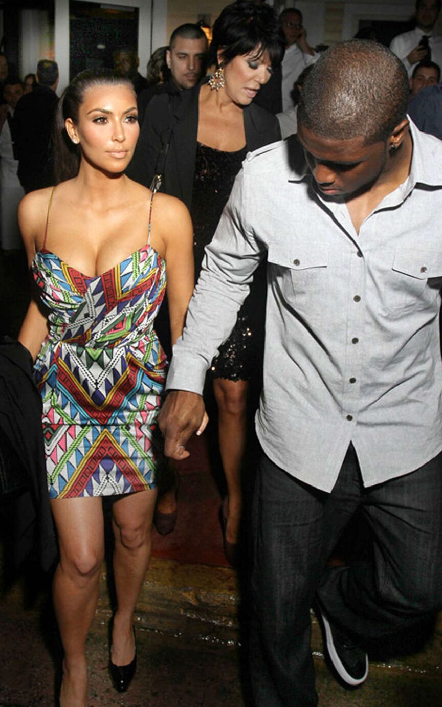 Kim Kardashian very leggy in colorfull mini skirt and posing sexy in fishnets st