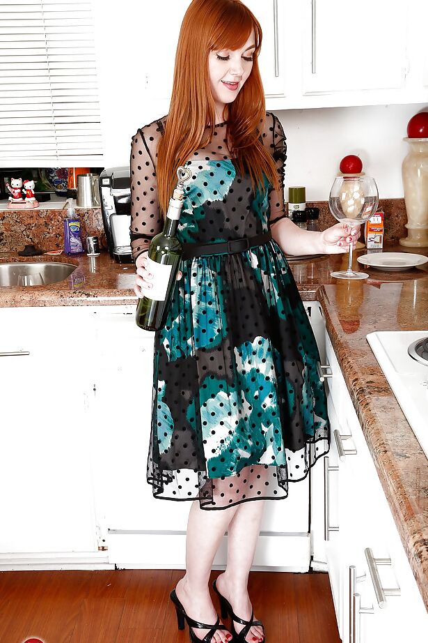 Redheaded mom Marie McCray slipping panties over ass and bush in kitchen